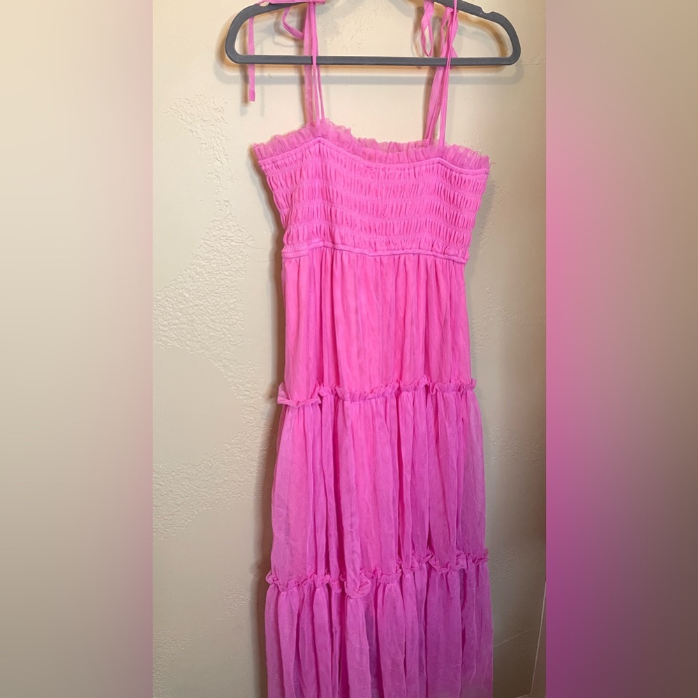 Hot pink tulle maxi with adjustable tie straps and smocked top